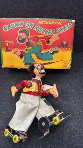 lot 16 image: Vintage Mechanical Clown on Roller Skates Toy with Original Box