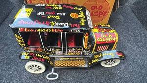 lot 23 image: Vintage Marx Mechanical Jalopy Tin Toy Car with Original Box