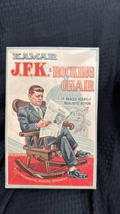 lot 31 image: Vintage Kamar JFK Rocking Chair Doll with Mechanical Musical Movement