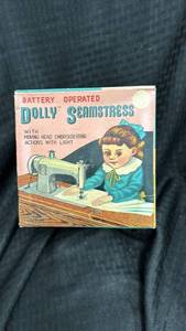 lot 35 image: Vintage Battery Operated Dolly Seamstress Toy