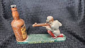 lot 51 image: Vintage Southern Comfort Cast Iron Bank 
