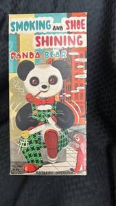 lot 59 image: Battery-Operated Smoking and Shoe Shining Panda Bear Toy