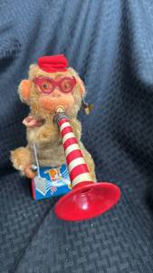 lot 60 image: Vintage Wind-Up Monkey Toy with Trumpet