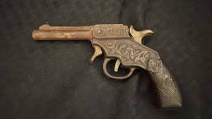 lot 80 image: Vintage Rusted Toy Cap Gun with Intricate Design