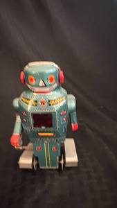 lot 82 image: Vintage Wind-Up Tin Robot Toy with Surface Scratches