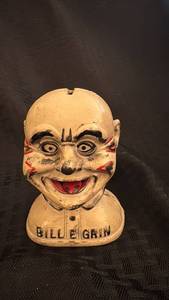lot 85 image: Antique Bill E Grin Cast Iron Bank with Paint Loss