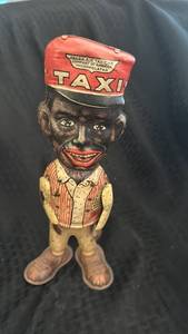 lot 96 image: Amos n Andy Fresh Air Taxicab Tin Wind-Up Toy by Louis Marx & Co