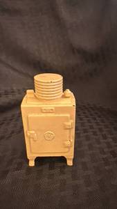 lot 109 image: Vintage Cast Iron General Electric Toy Stove Piggy Bank