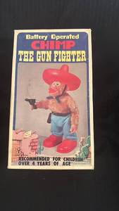 lot 121 image: Battery Operated Chimp The Gun Fighter Toy