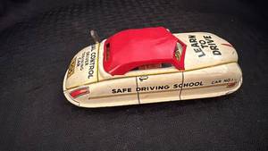 lot 151 image: Vintage Wind-Up Toy Car Learn to Drive Model 305