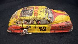 lot 154 image: Vintage Tin Toy Taxi Car with Open Air Design