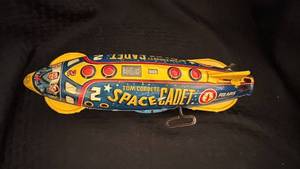 lot 168 image: Vintage Tom Corbett Space Cadet Tin Toy Rocket with Paint Wear