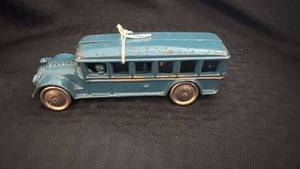 lot 169 image: Vintage Blue Cast Iron Toy Bus with Paint Wear and Rust
