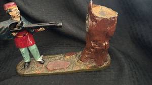 lot 178 image: Vintage Cast Iron Mechanical Coin Bank Hunter Theme
