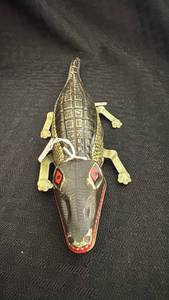 lot 188 image: Vintage Wind-Up Tin Alligator Toy with Surface Wear