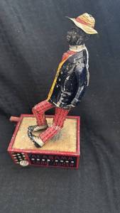 lot 190 image: Vintage Alabama Coon Jigger Tin Toy by Lehmann