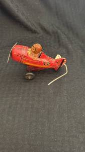 lot 191 image: Vintage Tin Wind-Up Toy Airplane with Aviator Pilot