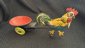 lot 192 image: Vintage Tin Rooster Pull Toy with Paint Wear and Rust
