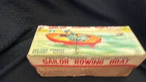 lot 204 image: Vintage Friction-Powered Sailor Rowing Boat Toy with Box