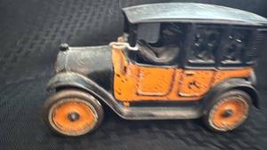 lot 215 image: Vintage Cast Iron Toy Car with Orange Accents