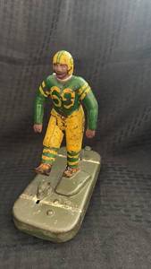 lot 216 image: Antique Wooley Cast Iron Football Player Toy with Base