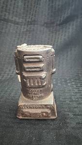 lot 223 image: Vintage Heater-Shaped Cast Iron Still Bank with Surface Rust