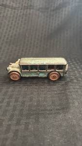 lot 228 image: Vintage Metal Toy Bus with Paint Wear and Rust