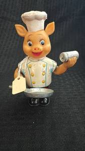 lot 230 image: Vintage Wind-Up Pig Chef Toy with Spoon and Grinder