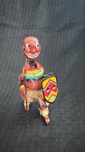 lot 233 image: Vintage Wind-Up Tin Toy Tribal Warrior with Shield and Spear