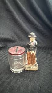 lot 249 image: Vintage Charlie Chaplin Glass Bank with Tin Lid