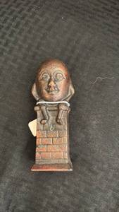 lot 254 image: Vintage Cast Iron Humpty Dumpty Coin Bank