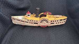 lot 273 image: Antique Tin Toy Boat with Paddle Wheels and Steam Stack