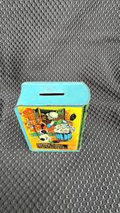 lot 311 image: Vintage Old Mother Hubbard Tin Bank with Surface Wear