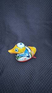 lot 324 image: Vintage Tin Wind-Up Duck Toy with Surface Wear