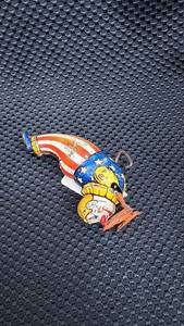 lot 340 image: Vintage Tin Wind-Up Toy Clown with American Flag Pattern