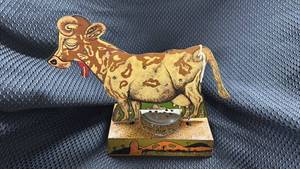 lot 353 image: Vintage Wind-Up Tin Toy Cow with Paint Flaws