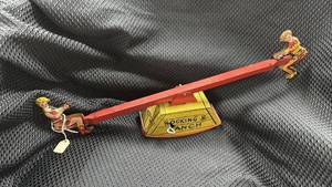 lot 354 image: Vintage Walt Reach Rocking Ranch Tin Toy See-Saw