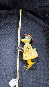 lot 371 image: Vintage Wind-Up Duck Firefighter Climbing Ladder Toy