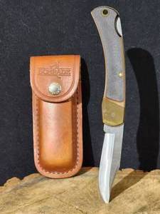 lot 138 image: 1997 OTC Commemorative Schrade Old Timer Locking Blade Knife Serial # 0057