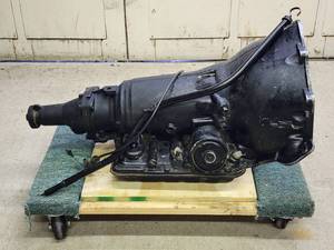 lot 296 image: Old School GM Transmission on a rolling platform