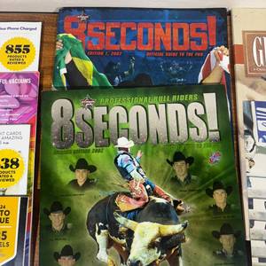 lot 84 image: Souvenir Magazines 8 Seconds Edition 1, 2007 8 Seconds Summer Edition 2002 Calgary Stampede Souvenir Program July 2003 Signed Posters