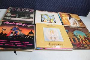 lot 320 image: Collection of 13 Vintage Vinyl Records Featuring Renowned Artists