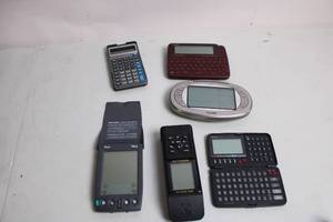 lot 347 image: Collection of Digital Devices Calculator, E-Reader, GPS & More