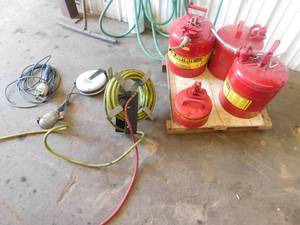 lot 37 image: 4- Safety Gas Cans, 2 - Trouble Lights & 1 - Hose Reel