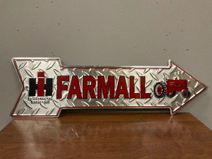 lot 18 image: Farmall Arrow Shaped Metal Sign