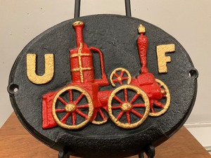 lot 24 image: UF Fire Badge Cast Iron Plaque