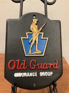 lot 28 image: Old Guard Insurance Group Cast Iron Plaque