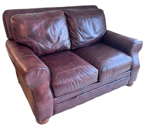 lot 21 image: Brown Leather Loveseat in Great Condition
