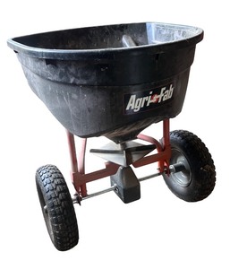 lot 34 image: Agri-Fab Tow-Behind Broadcast Spreader with Pneumatic Tires