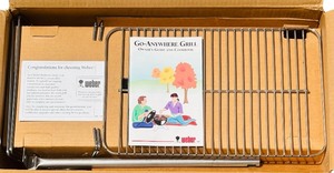 lot 53 image: New in Box Unlimited Program  Weber Go-Anywhere Grill and Cookbook